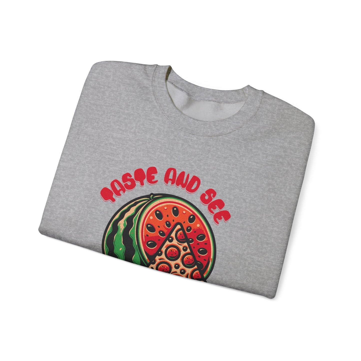 Folded gray sweatshirt featuring 'Taste and See the Lord is Good' inspirational message with pizza and watermelon graphic. Spiritual fashion staple.