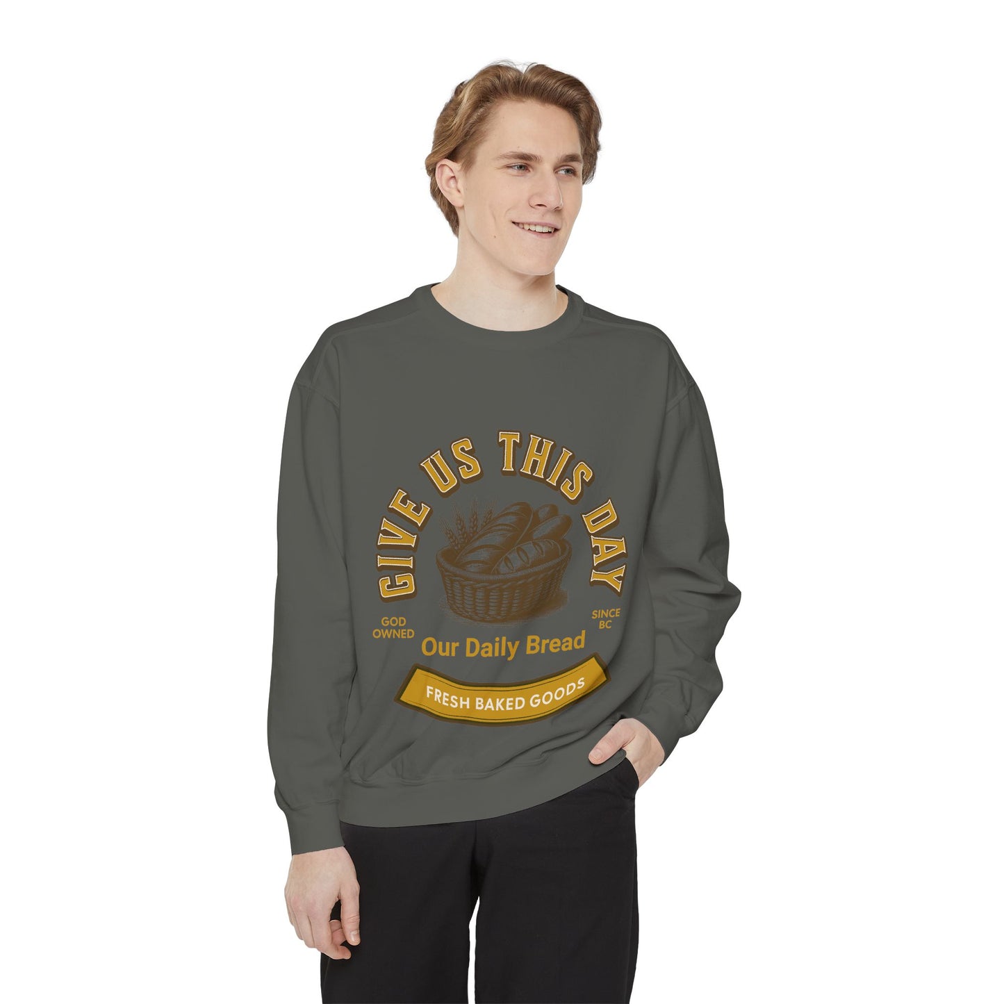 Model wearing charcoal gray Inspirational Crewneck Sweatshirt with 'Give us this Day Our Daily Bread' design. Religious apparel for everyday wear.