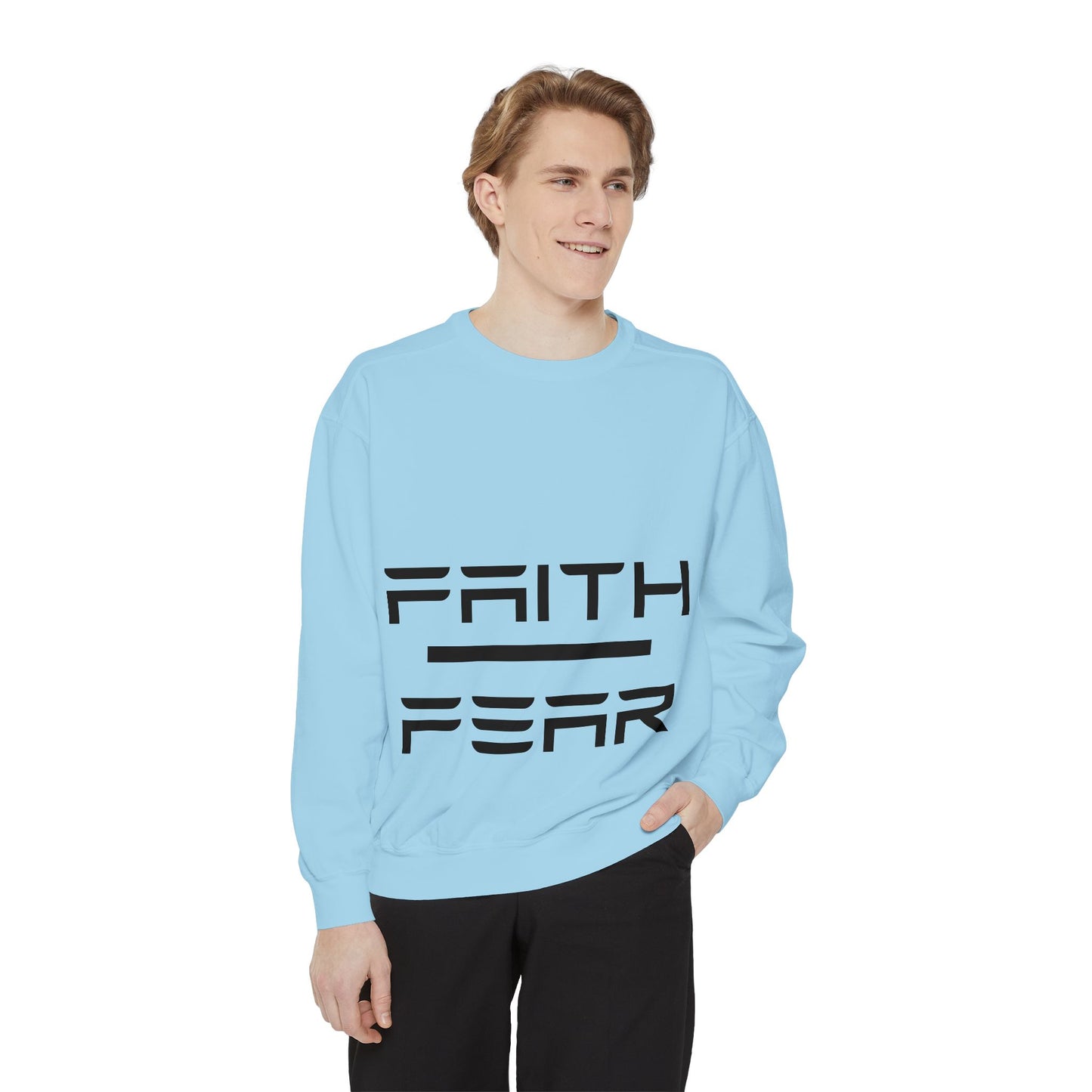 Model in light blue Faith Over Fear sweatshirt, styled for casual wear with bold black typography and cozy unisex fit.
