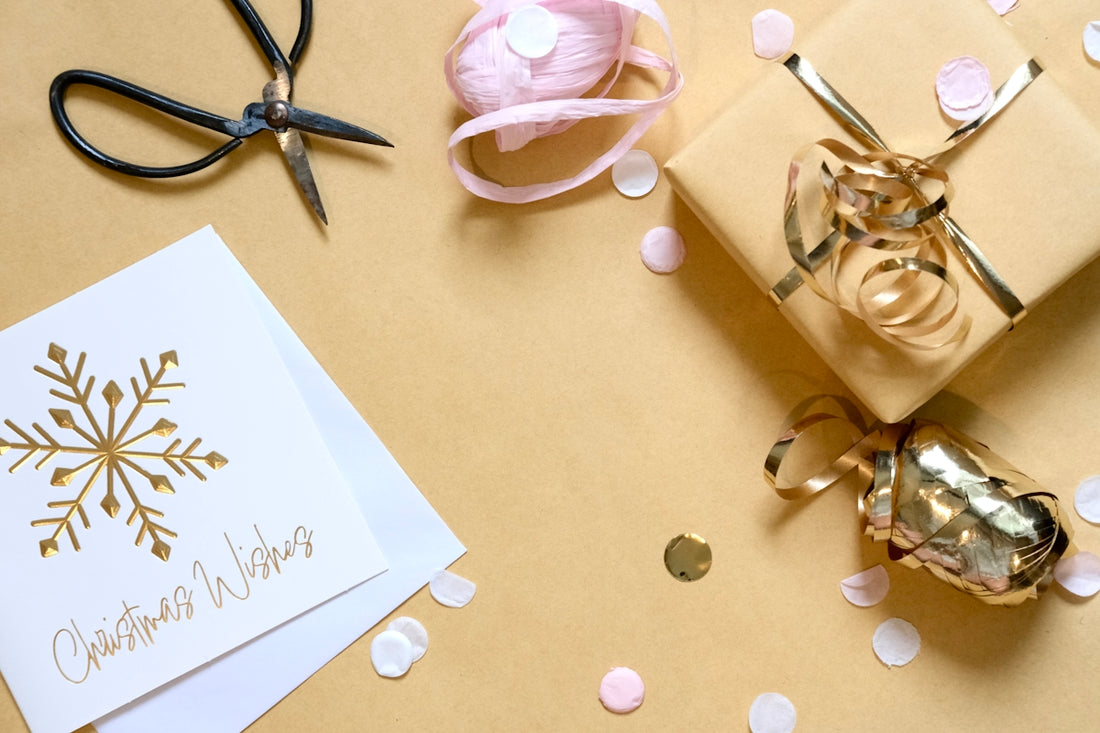 Gift wrapping with card, scissors, and ribbon
