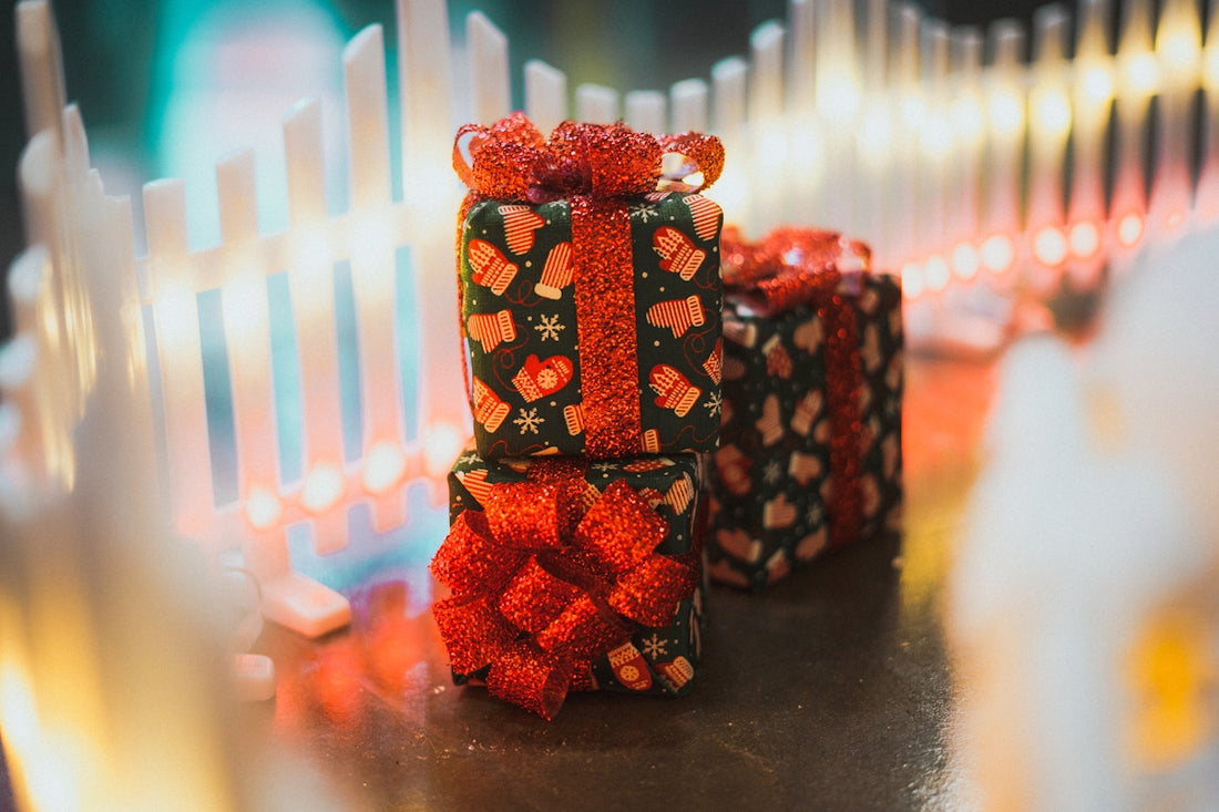 Christmas presents with red bows and festive wrapping.