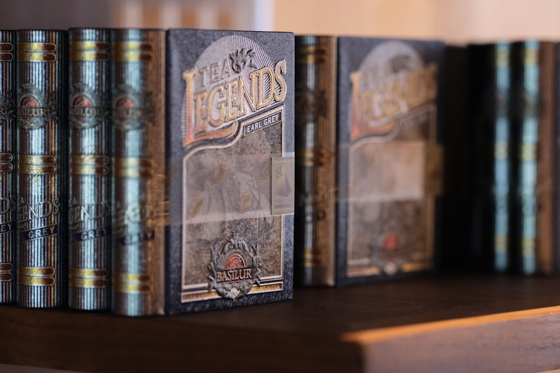Row of vintage books on a wooden shelf.