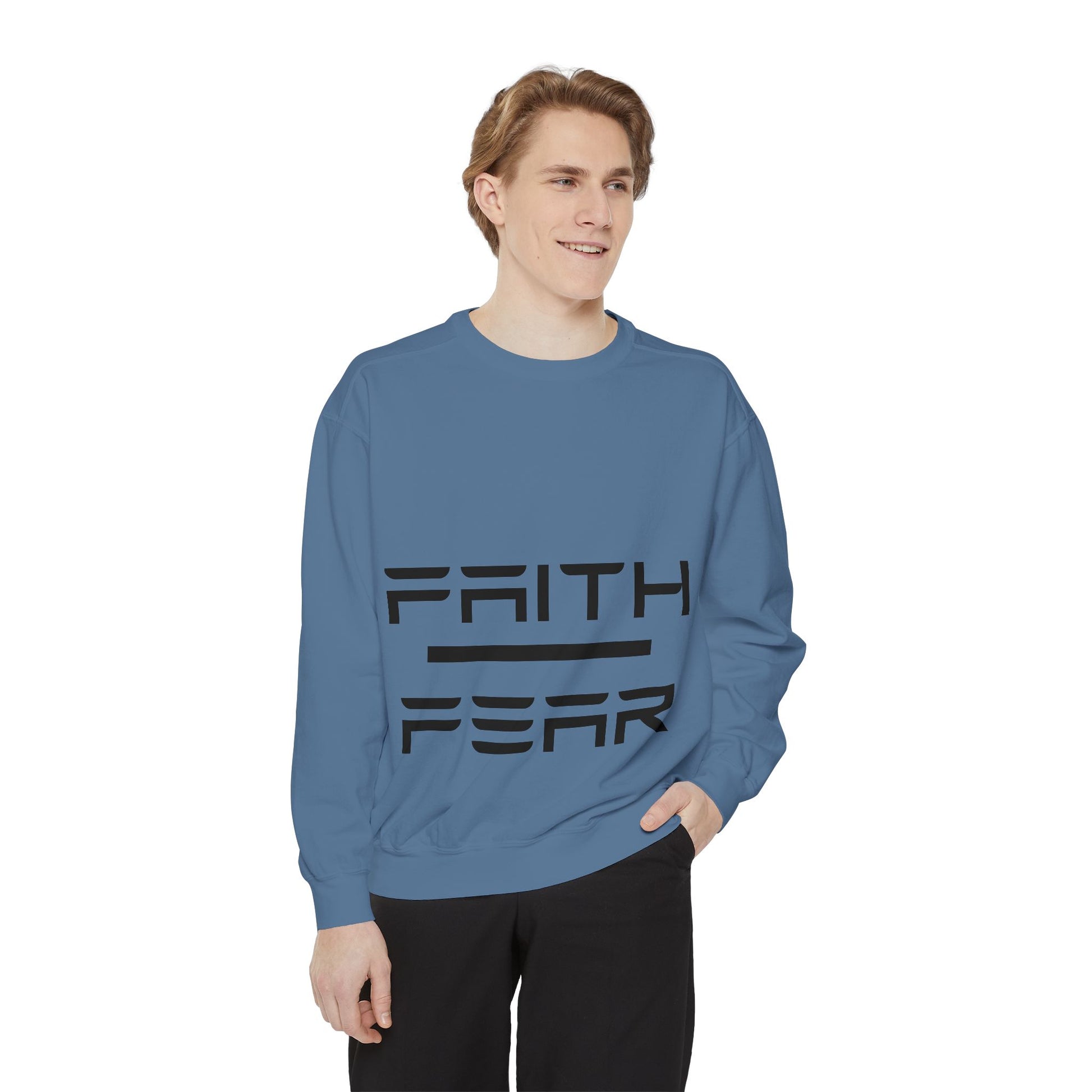 Model in dusty blue Faith Over Fear sweatshirt, featuring bold black text for a motivational and stylish unisex casual look.