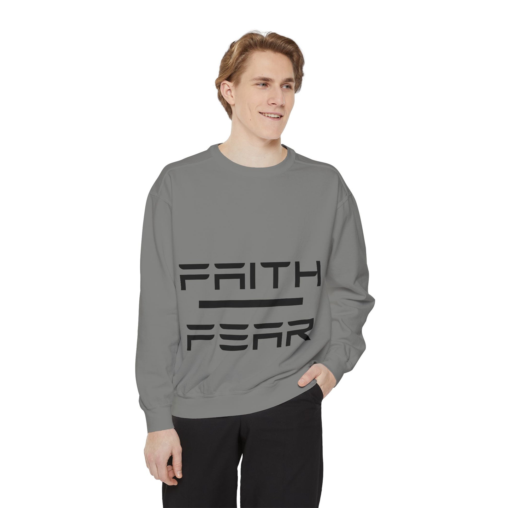 Model in gray Faith Over Fear sweatshirt with bold black lettering, cozy unisex pullover for inspirational streetwear and casual comfort.